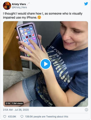 Kristy holding her iPhone